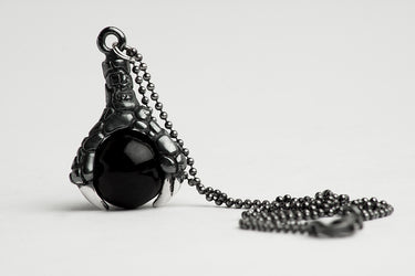 Dije garra de dragon con onix.